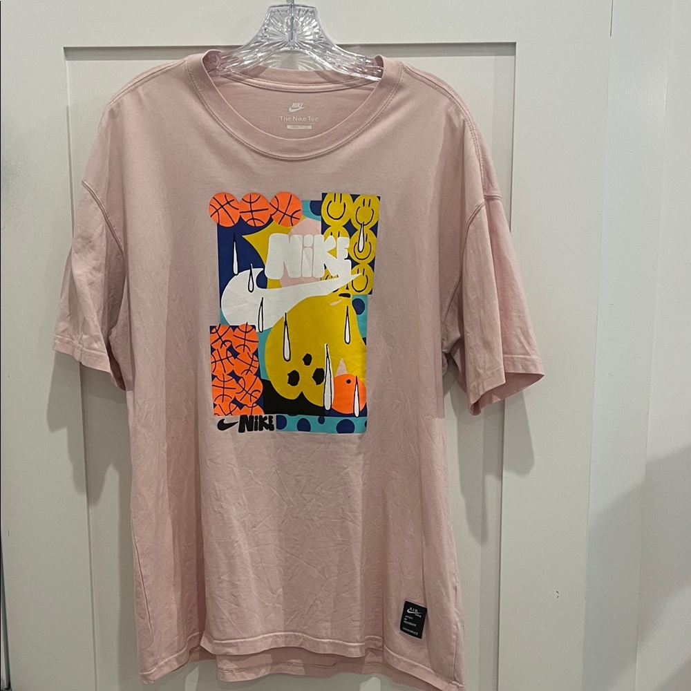 Nike Pastel Pink Tee with Vibrant Graphic in good condition. Mens size small